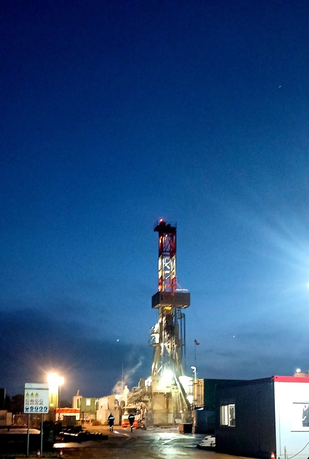 Industrial drilling operation at night